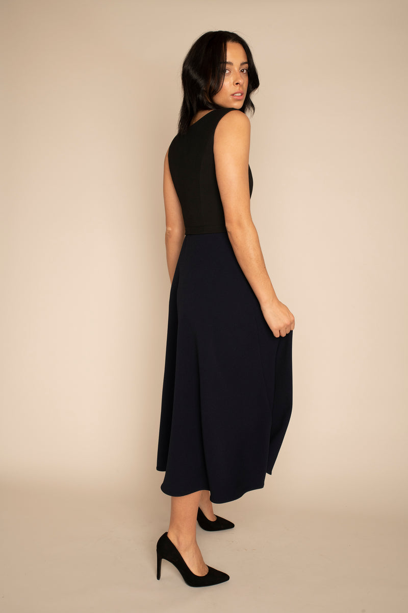 Black Sleeveless Eleanor Top with the Navy Midi Elizabeth Skirt with our signature Careaux zip around the waist.