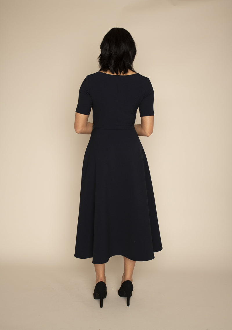 Back view of the navy sleeved Catherine top and the navy midi ELIZABETH skirt with our signature Careaux zip around the waist.