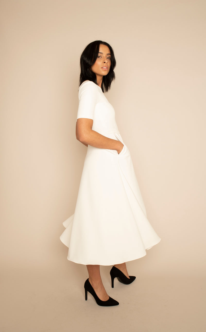 Ivory Sleeved Catherine Top with the Ivory Midi Elizabeth Skirt with pockets with our signature Careaux zip around the waist.