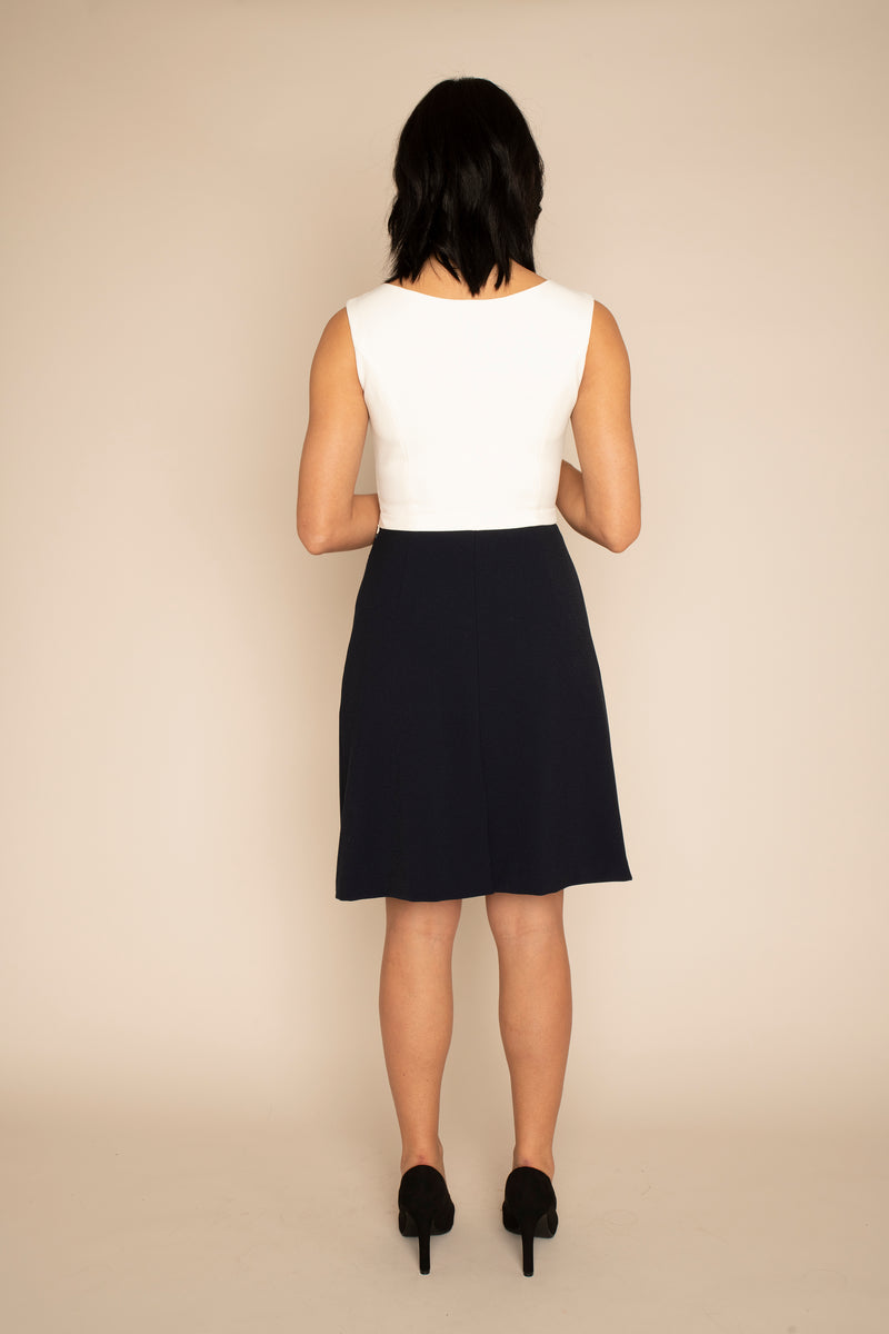 Back of Ivory Sleeveless Eleanor Top with the Navy A-Line Victoria Skirt with our signature Careaux zip around the waist.