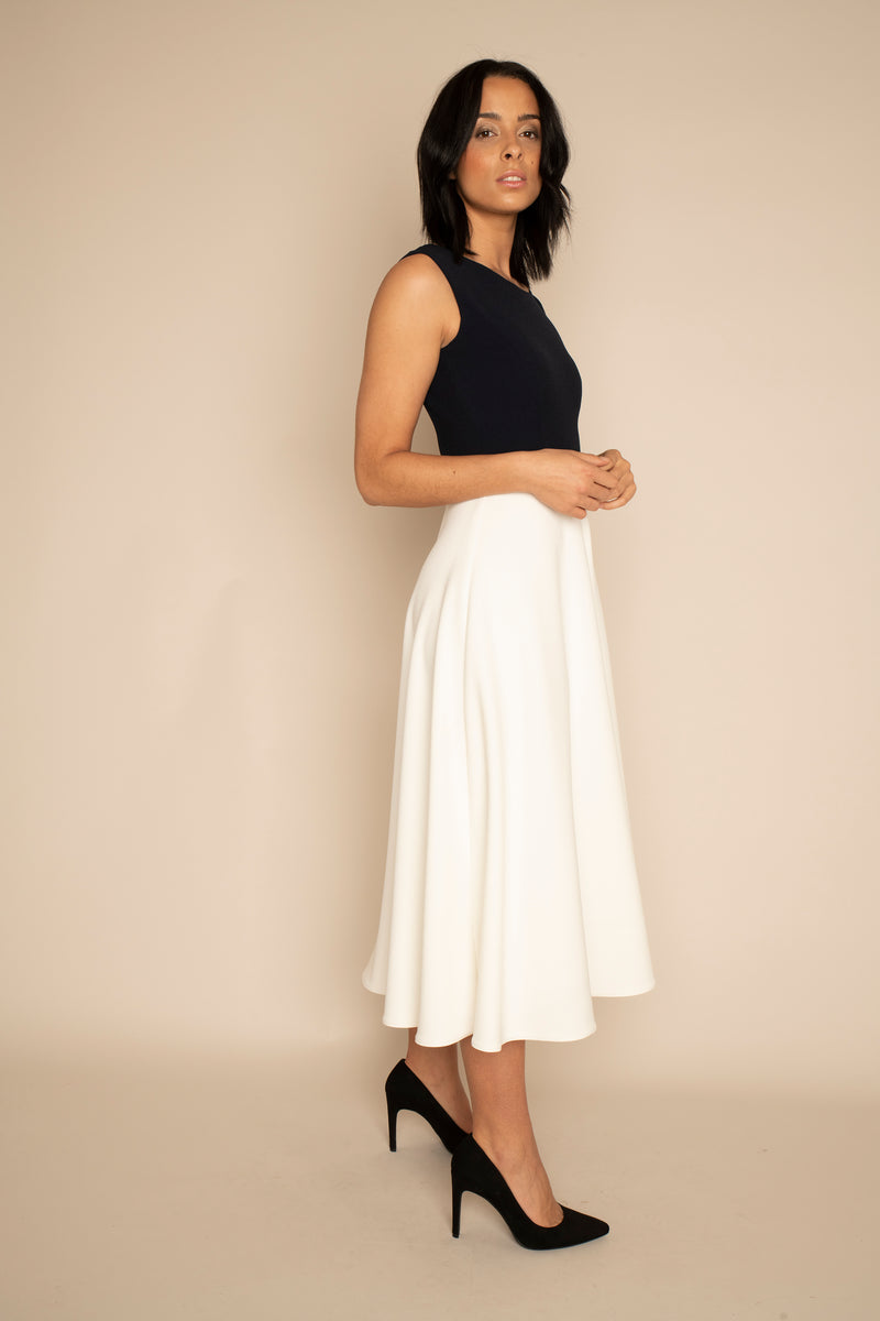 Navy Sleeveless Eleanor Top with the Ivory Midi Elizabeth Skirt with our signature Careaux zip around the waist.